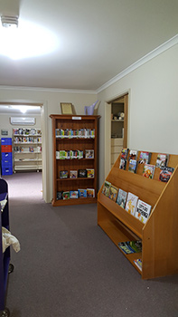A community volunteer at the new premises for the Pyramid Hill Library Agency with more space and updated shelving.  It is expected that the new library agencies will have a similar set up