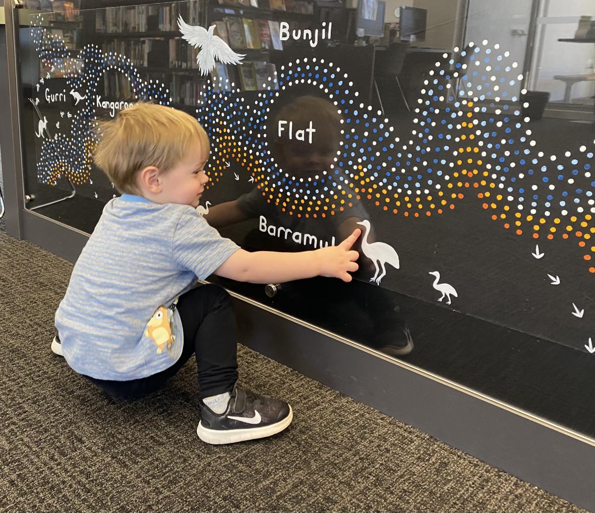 Child looking at new artwork at Kangaroo Flat Library