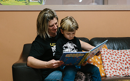 mother and son reading at Castlemaine Library