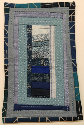 blue fabric formed into square frames