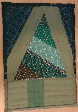 Blue and green fabric formed into a triangle