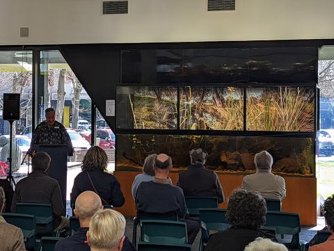 Bendigo Library Manager Robin Pearson speaking in front of audience at Bendigo Library Aquarium launch